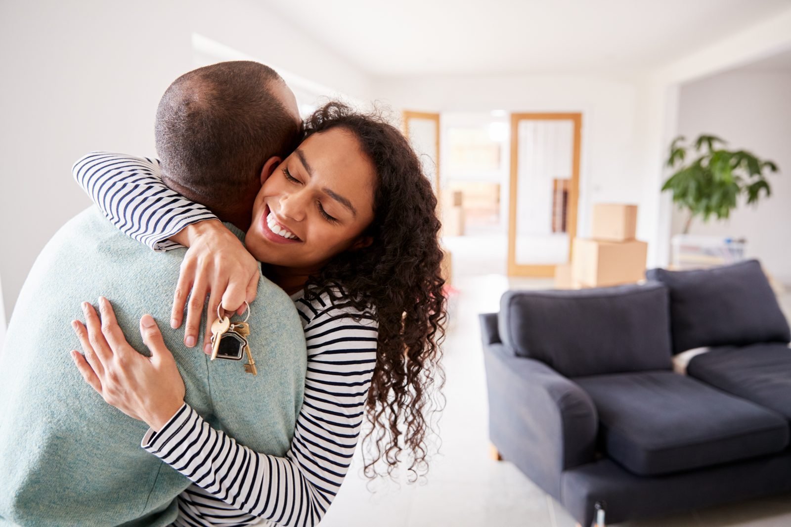 Couple celebrating with house keys